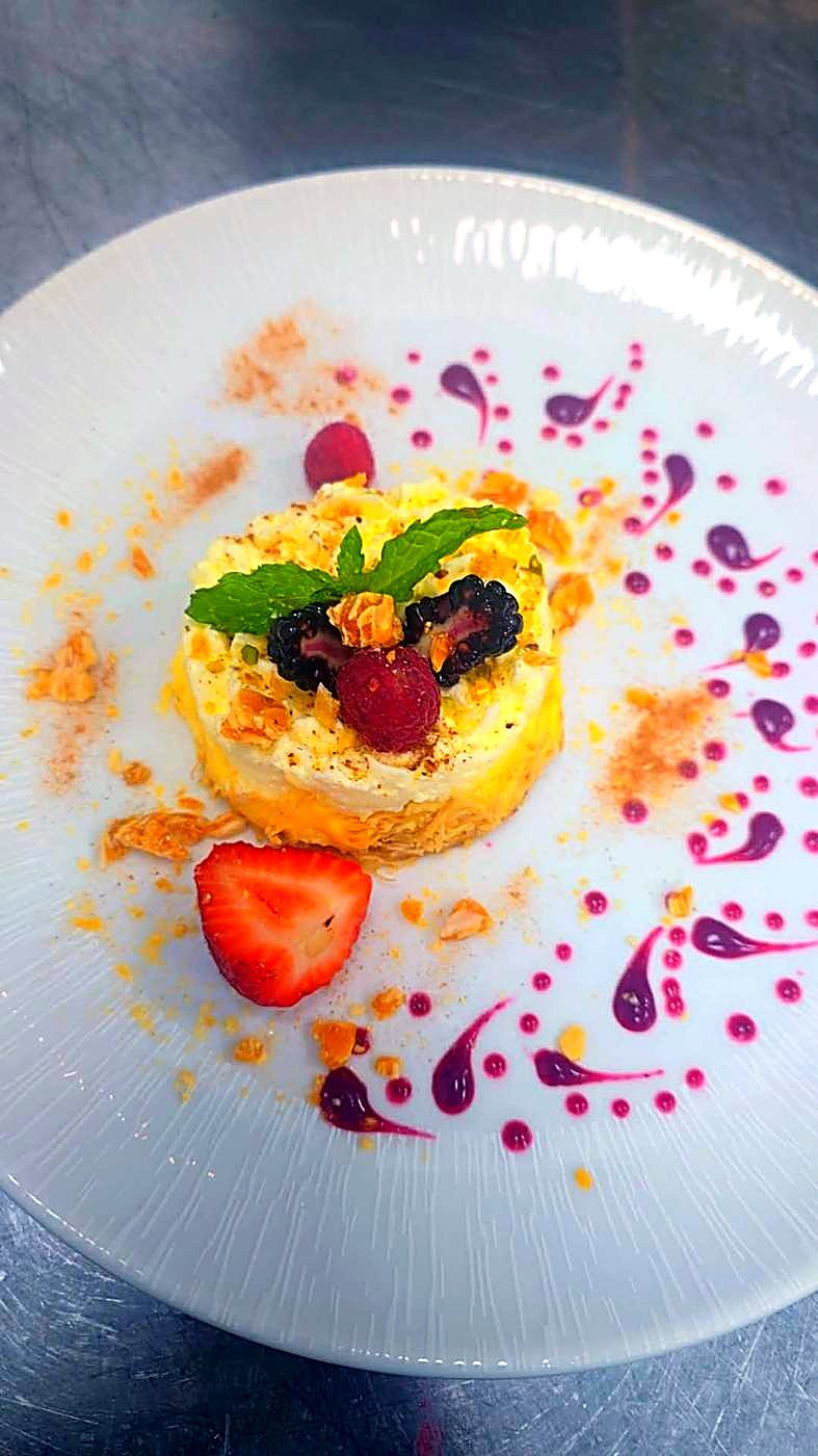 Layered cream dessert with fresh berries